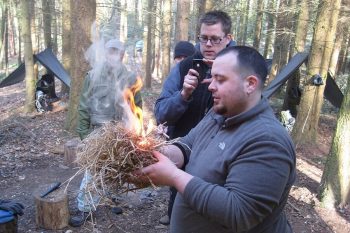 Scout leader successfully achieving fire-by-friction