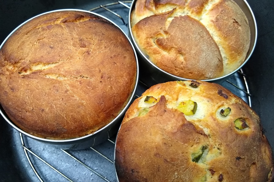 Three freshy baked loaves in Dutch oven